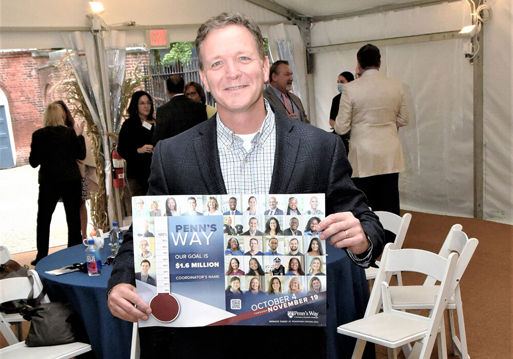 Penn's Way Campaign 2021 volunteer holding poster